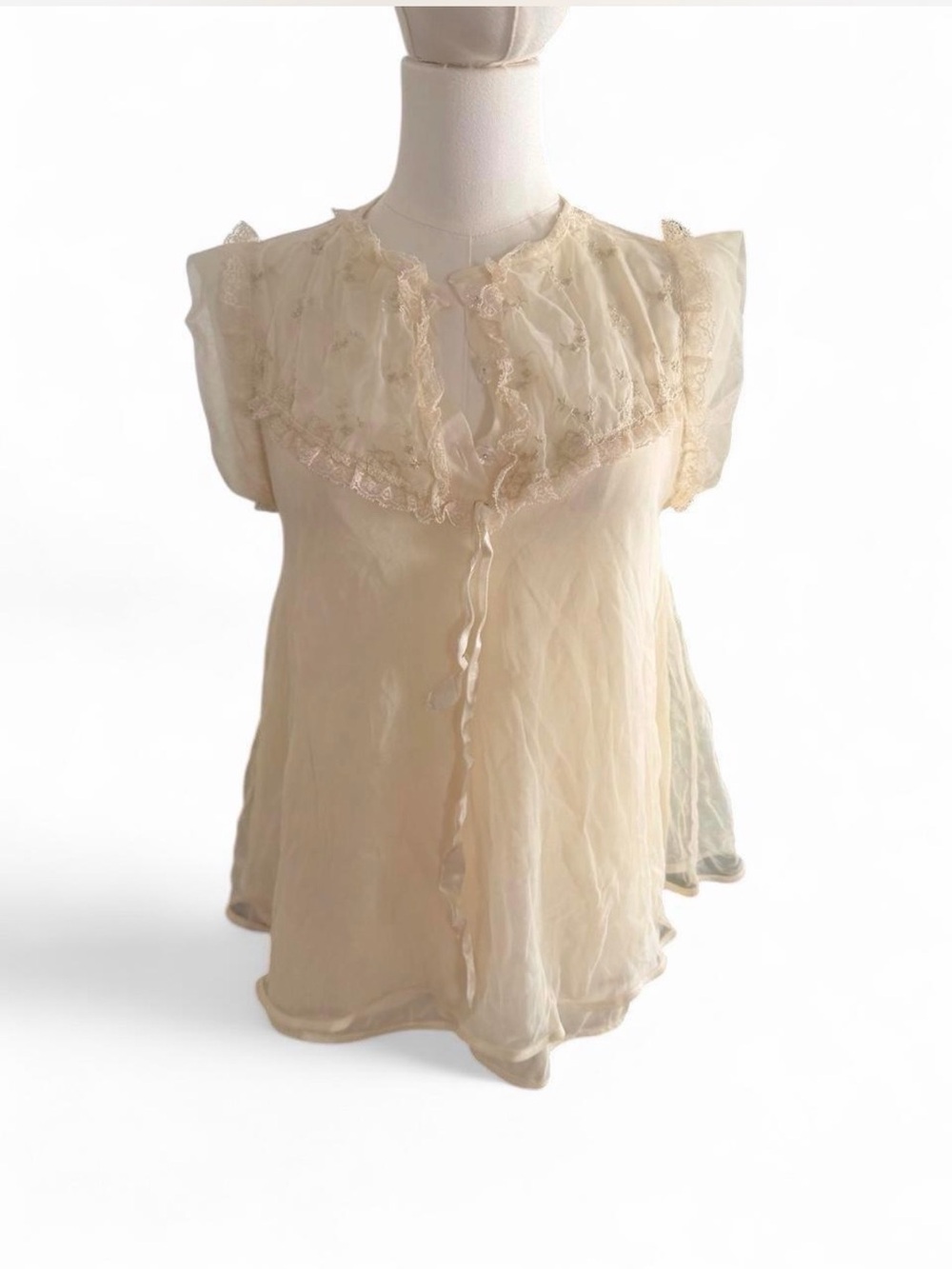 Sheer Ruffled Sleeveless Blouse in Cream